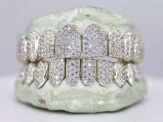 Diamond-studded dental grill on a neutral background