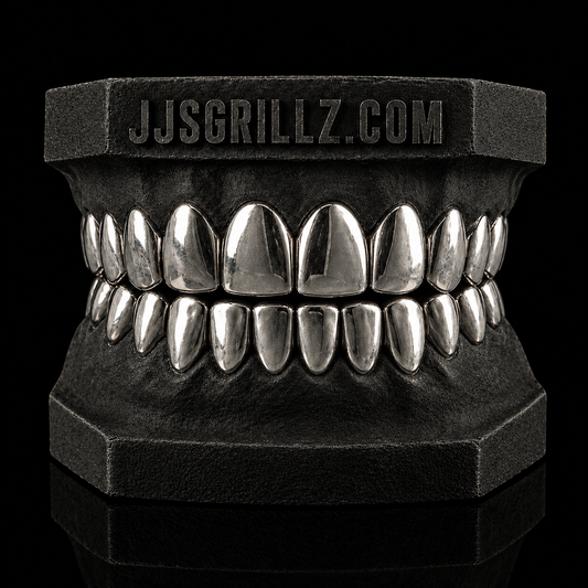 Custom .925 Sterling Silver Grillz by JJ’s Grillz displayed on a dental mould, showcasing the precision-fitted silver grillz design.