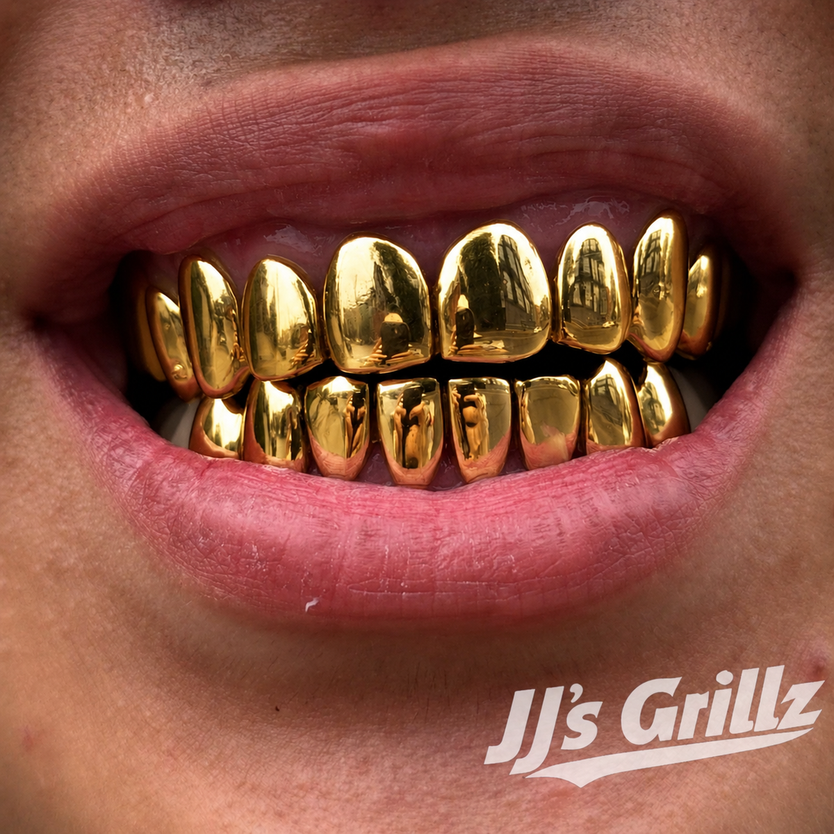 JJ’s Grillz gold grillz custom-fitted to a customer’s teeth, showcasing the finished grillz