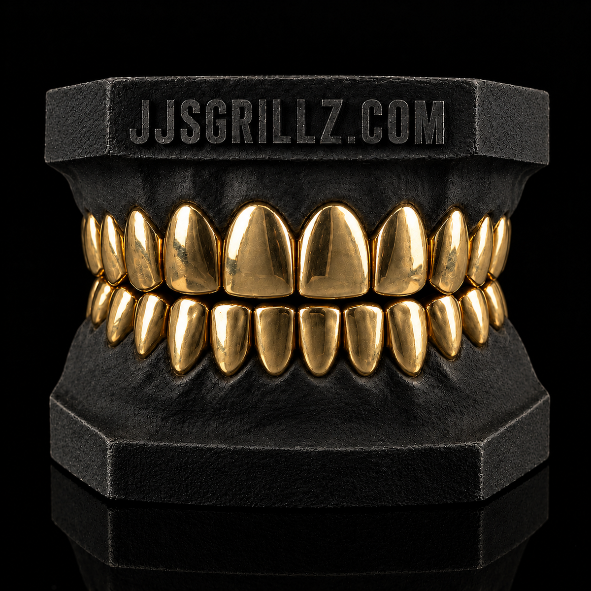 Custom Gold Grillz by JJ’s Grillz displayed on a dental mould, showcasing the precision-fitted gold grillz design.