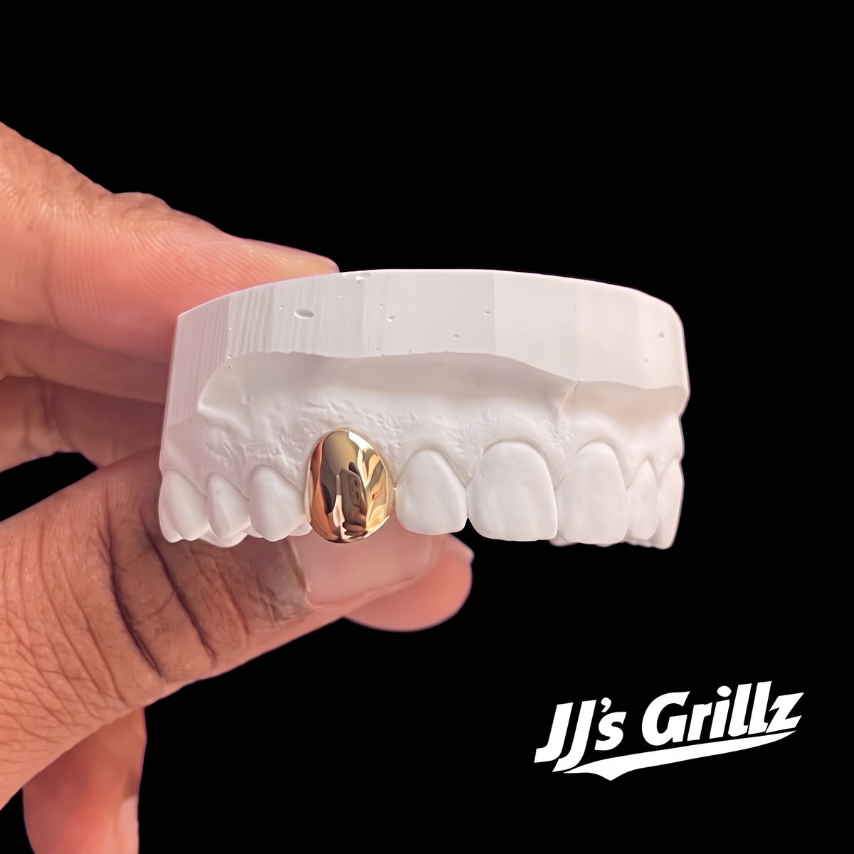 JJ’s Grillz gold tooth custom-made to your impression