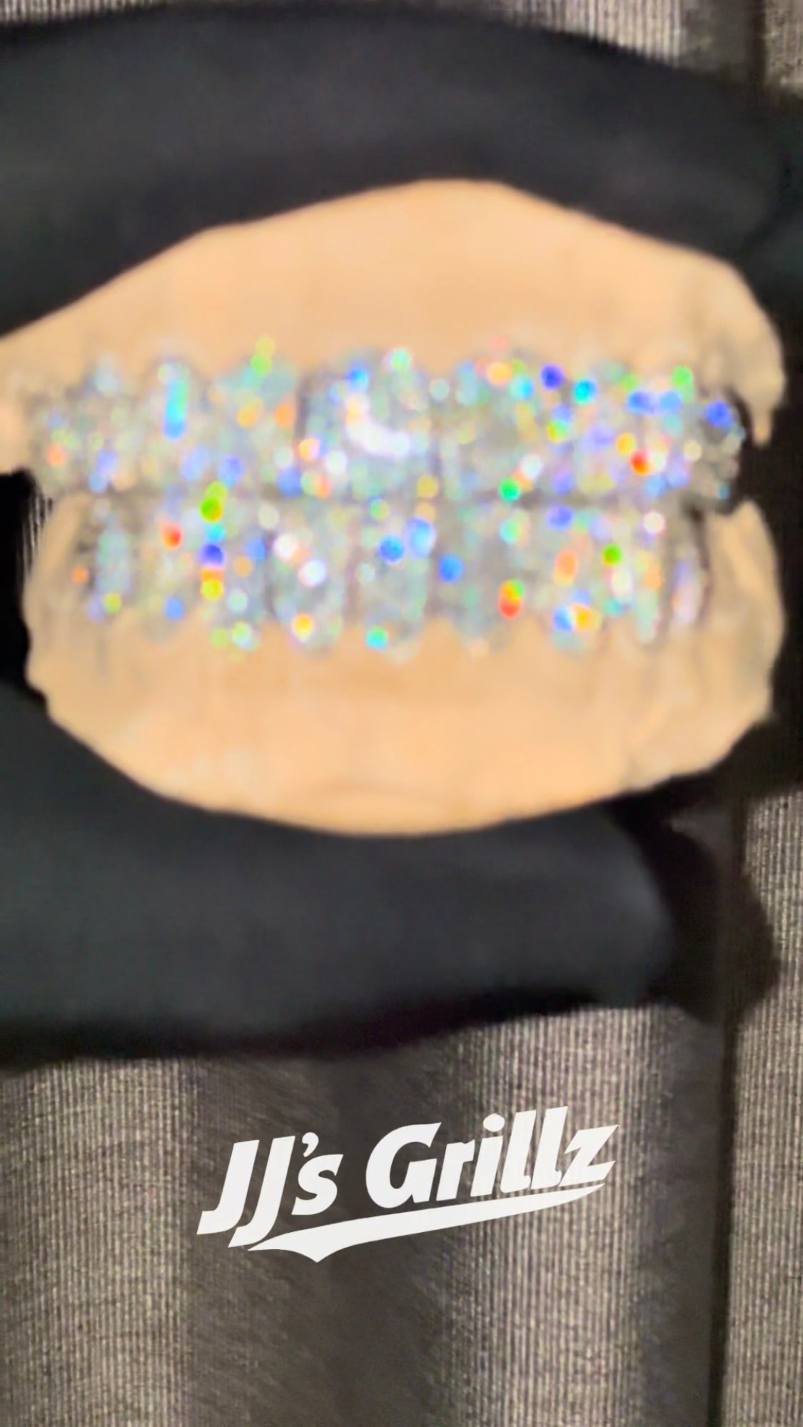 Video showcasing a custom grillz sets shine fire and brilliance. Made fully by JJ’s Grillz