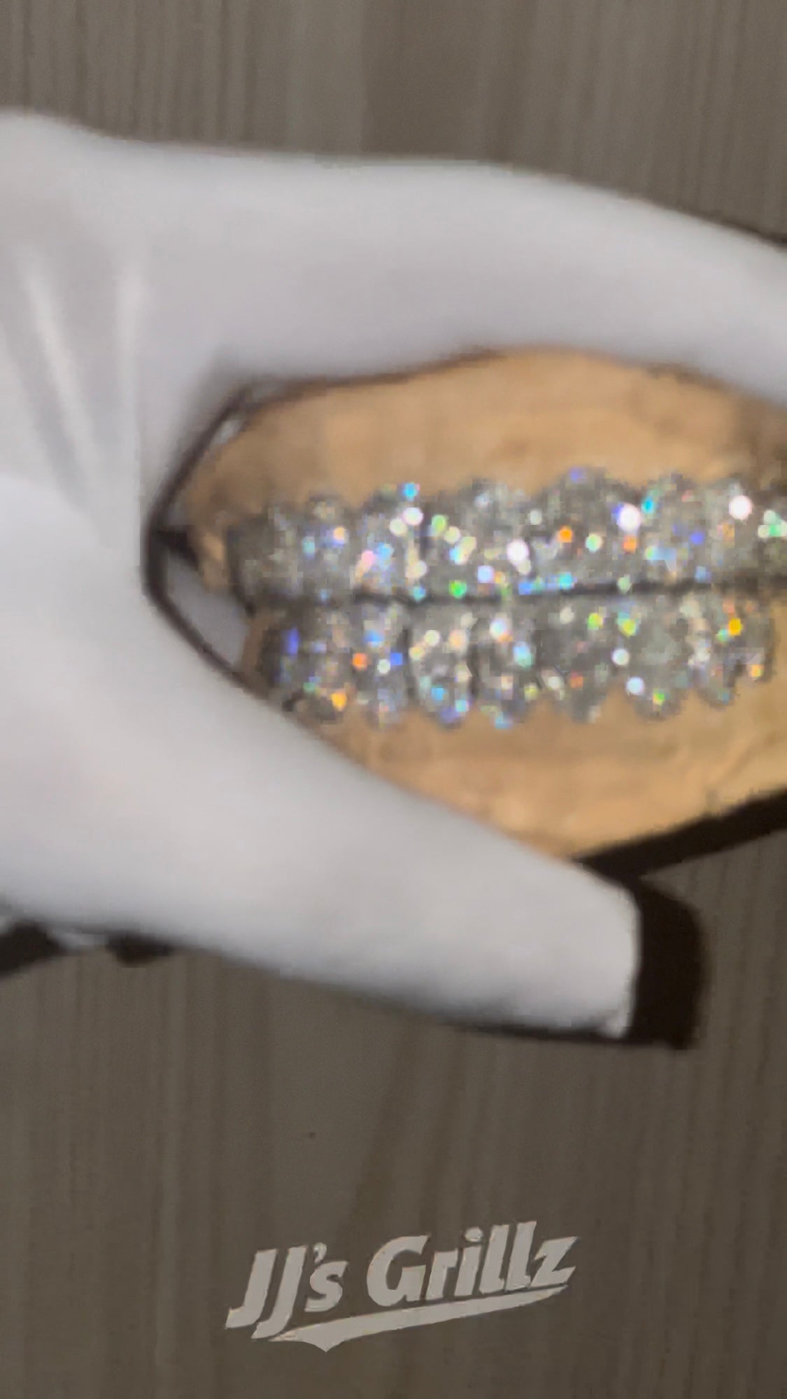 Video holding JJ’s Lab Diamond Grillz showcasing the grillz brilliance and sparkle. Made by JJ’s Grillz